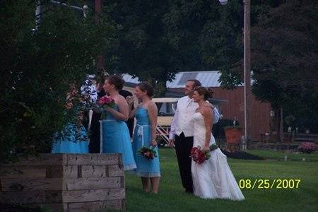 A beautiful outdoor tented wedding... the bridal party awaiting their grand entrance