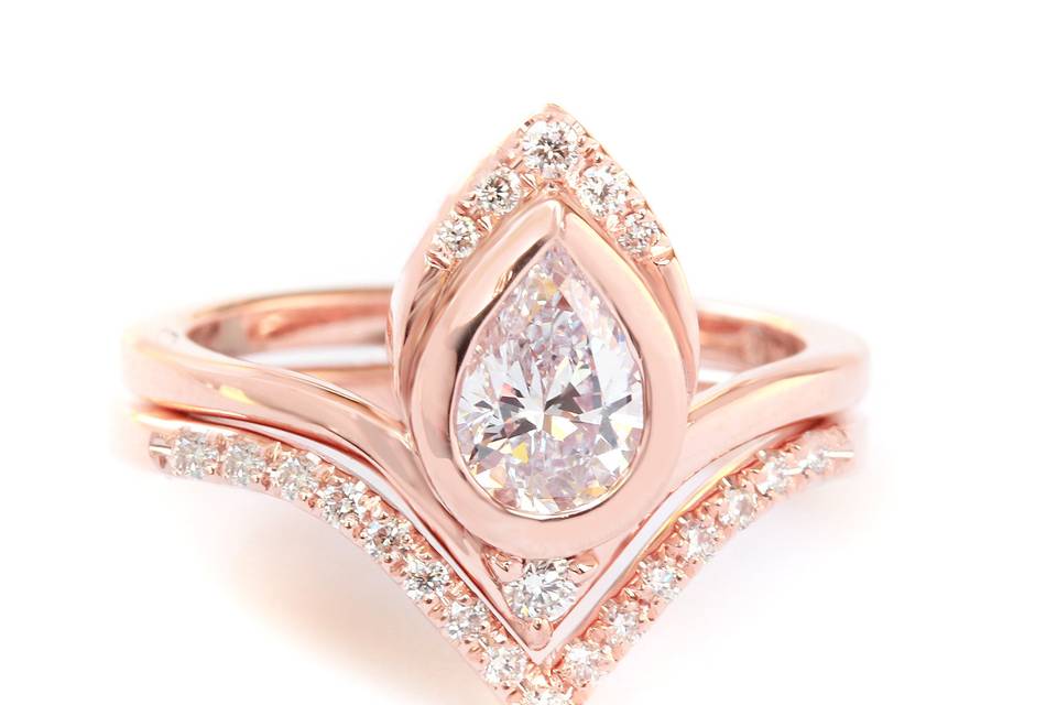 Unique pear shape diamond engagement rings set with matching diamond chevron V diamond ring in rose gold. original design by silly shiny diamonds