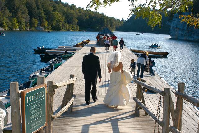 Bride and groom on boat dock