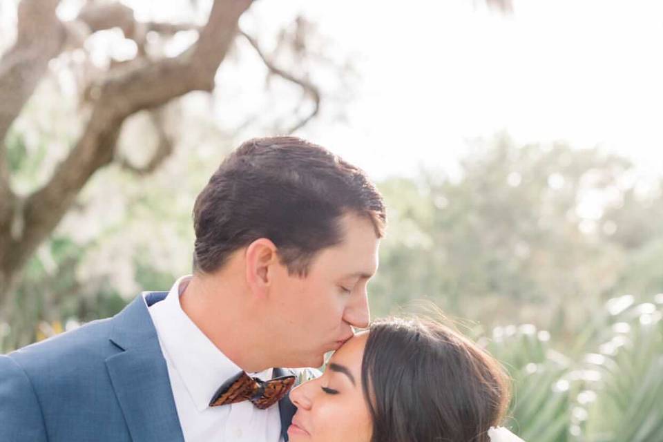 Groom kisses his bride