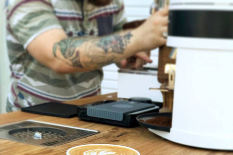 Latte with art on espresso cart