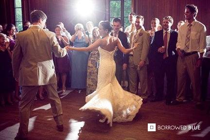 Groom dancing with his bride