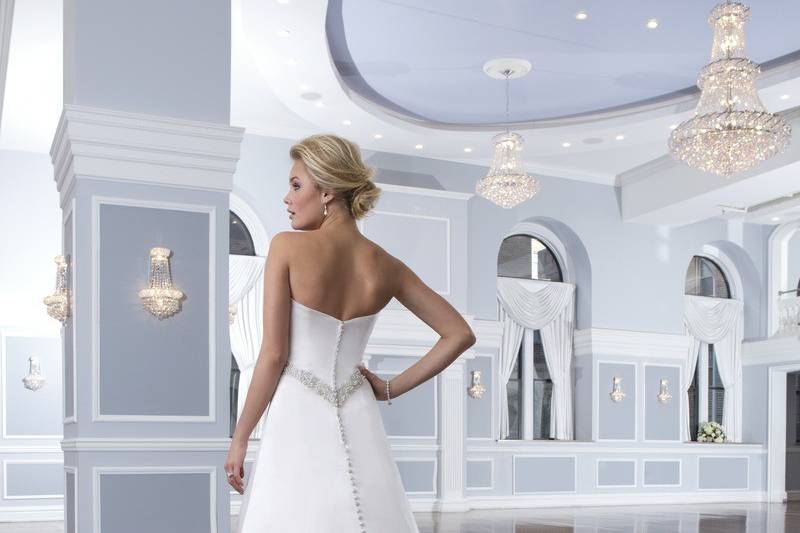 Style 6292
This sweetheart regal satin fit and flare has a gorgeous re-embroidered Alencon lace Vneckline overlay. Satin buttons are placed down the V-back and continue to the edge of the chapel length train.