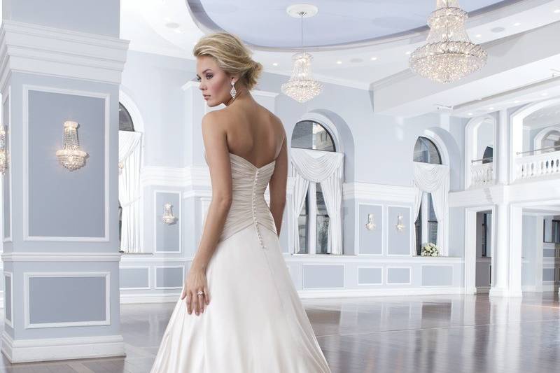 Style-Back 6293
The re-embroidered Alencon lace sweetheart neckline flows into a drop waistline that is followed by an A-line skirt. Tulle buttons cover the back zipper and continue to the edge of the chapel length train.