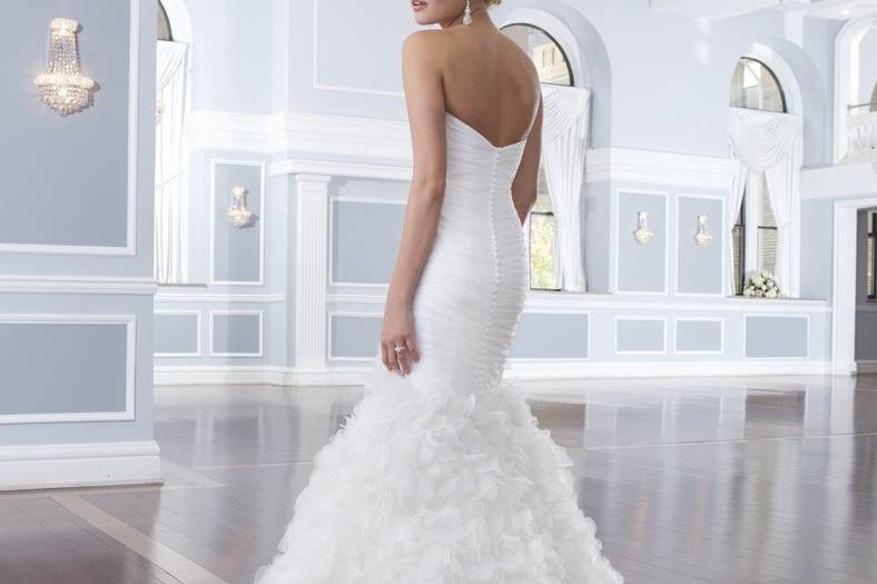 Style-Back 6298
Corded lace and tulle create the Mandarin neckline and cap sleeves on this fit and flare gown. The back of the dress has a surprising keyhole back neckline with tulle covered buttons over the back zipper that continue through the chapel length train.
