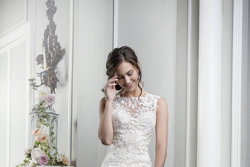 Style 6390 <br> Soft English net V-neckline over a slim jersey A-line gown with dreamy V-back. Unique beaded cotton Venice lace and stretch Jersey lining create a soft look for any outdoor venue.