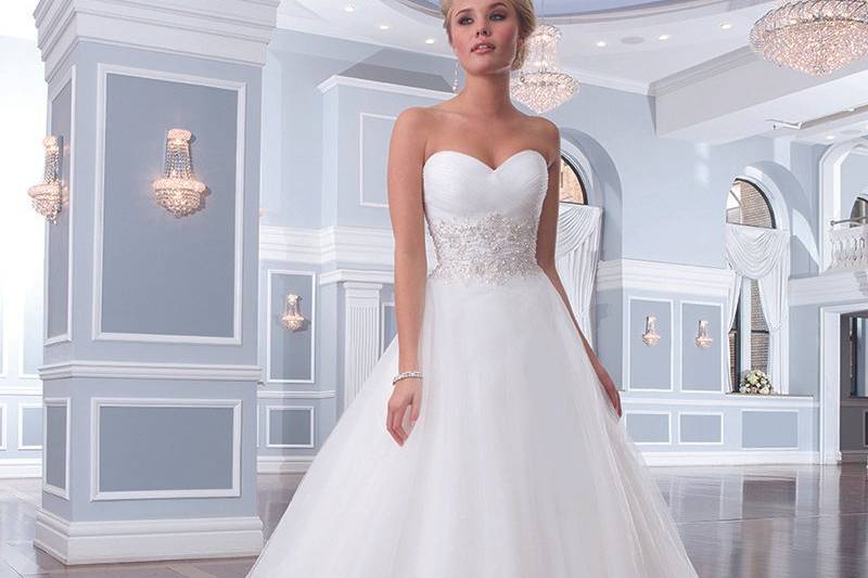 Lillian West	Preview 2014	Style No.	6295	<br>	This lace ball gown has an illusion Sabrina neckline that is trimmed with satin. The natural waist is accented with a regal satin belt featuring streamers. Tulle buttons enclose the V-back neckline and cover the back zipper. This wedding dress is finished off with a flowy chapel length train.