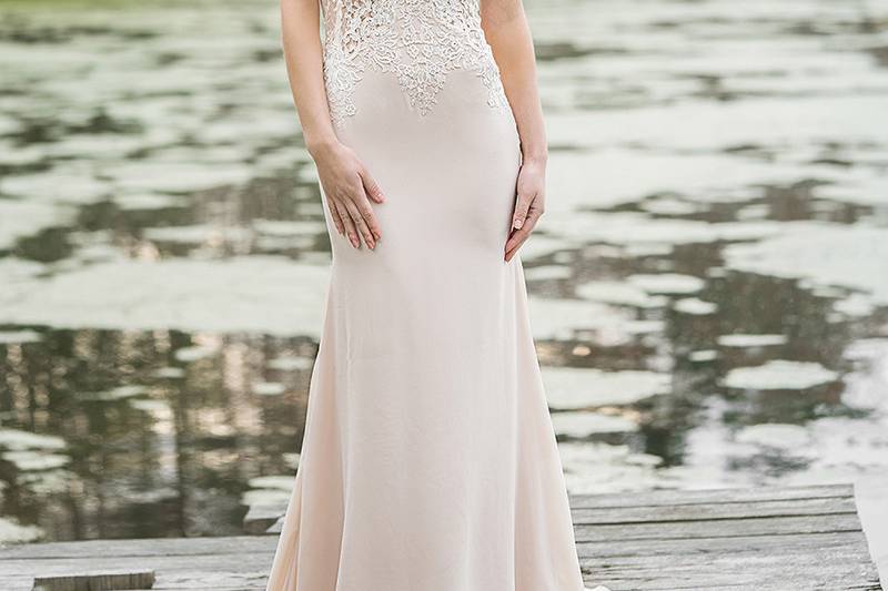 6451	<br>	The lace appliques, trimmed tiers, and soft skirt make this gown unique. A sweetheart neckline, natural waistline, and chapel length train complete the look.