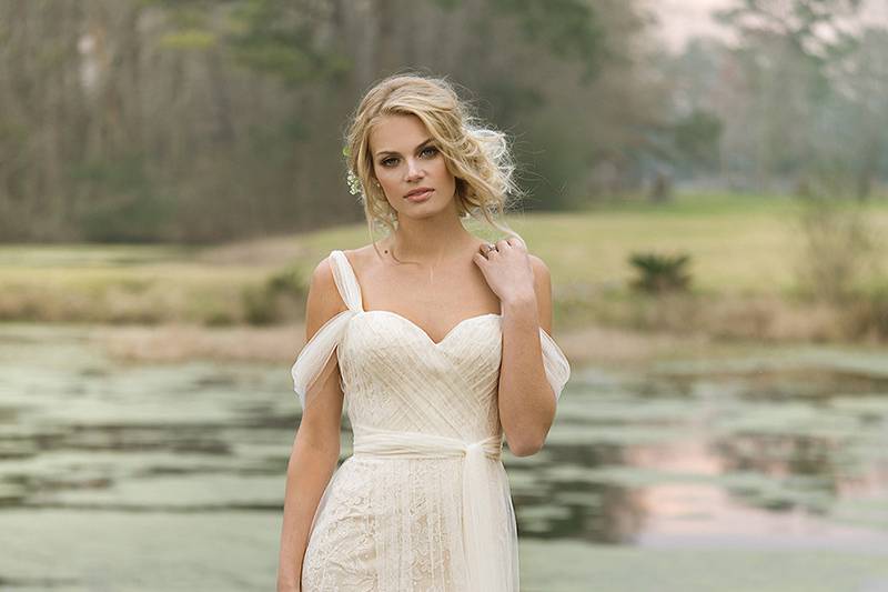 6453	<br>	Softly draped tulle and lace trim combine to create this dreamy long sleeve gown. A V-neck, illusion long sleeves and back, cotton lace appliques, and finished hem lace are completed by a sweep train.