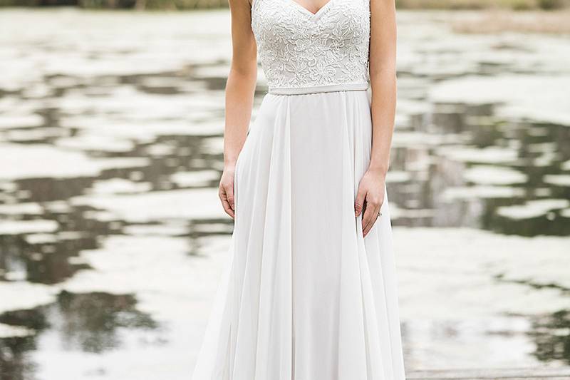 6465	<br>	The unexpected monarch length train adds vigor to this fit and flare gown with a sweetheart neckline, allover lace design, and tiered lace trimmed skirt. Desire a train that is slightly shorter in length? This style is available with an 80 inch train as style 6465T80.