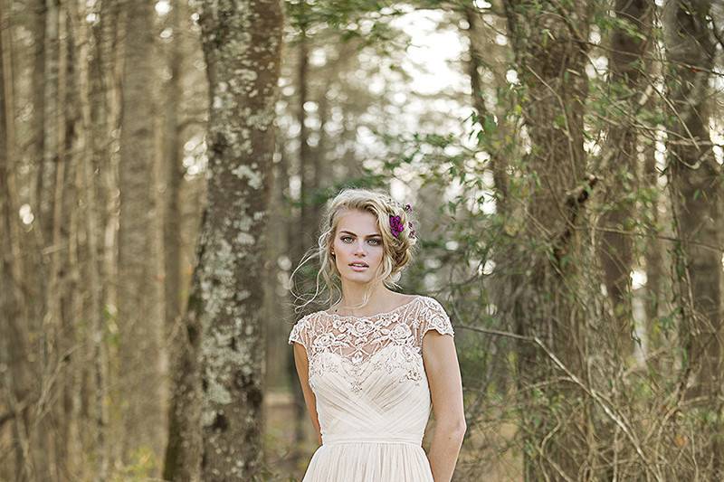 6468		Crocheted lace creates a geometric pattern on this halter, racerback, A-line gown with a beautiful hue and chapel length train.