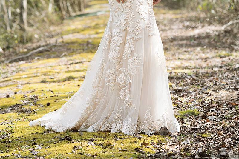 6470		Hand beaded details adorn this English net slim A-line gown with an illusion beaded back, Jersey lining, and chapel length train.