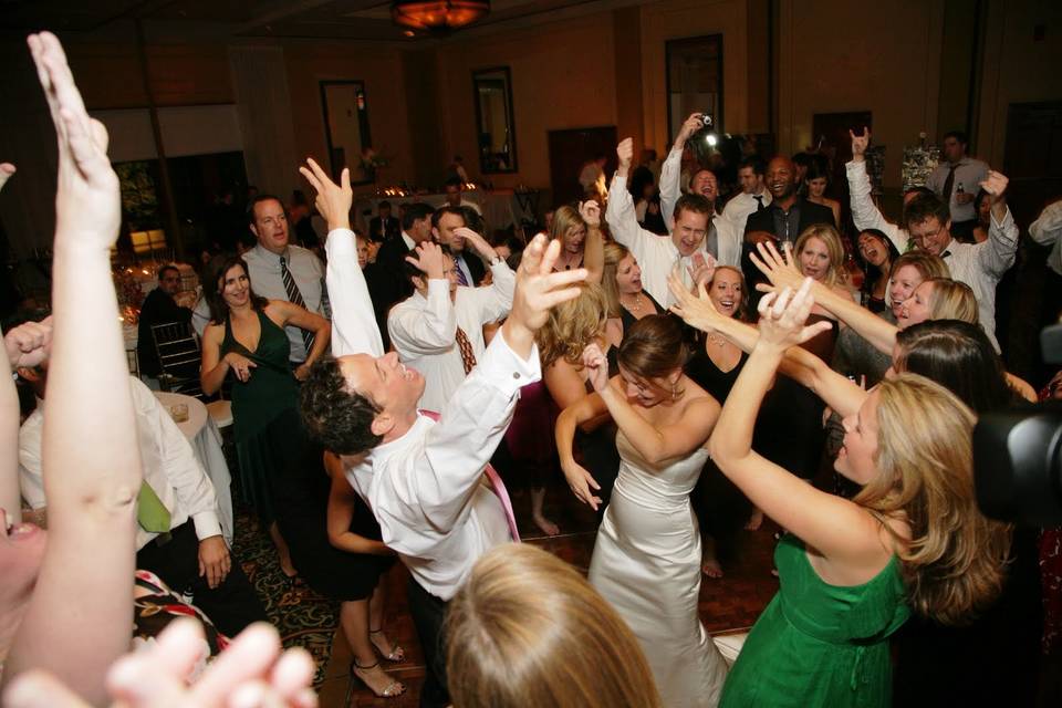 Couple and guests dancing