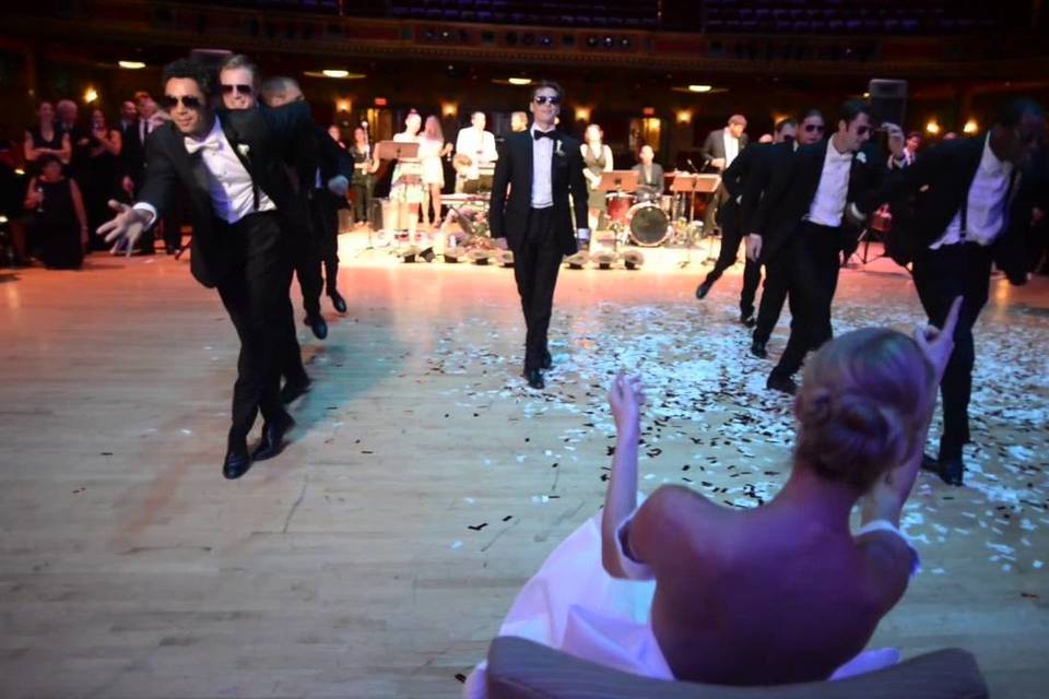 Groom and groomsmen dancing