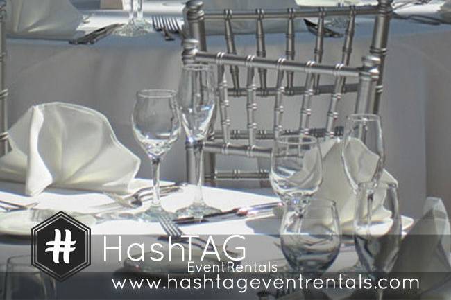 Silver Chiavari Chair, white cushion, 60in Round Table, White Linen set up for reception.