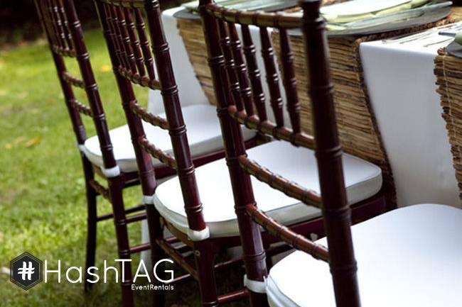 Mahogany Chiavari Chair with white cushion set up for reception.