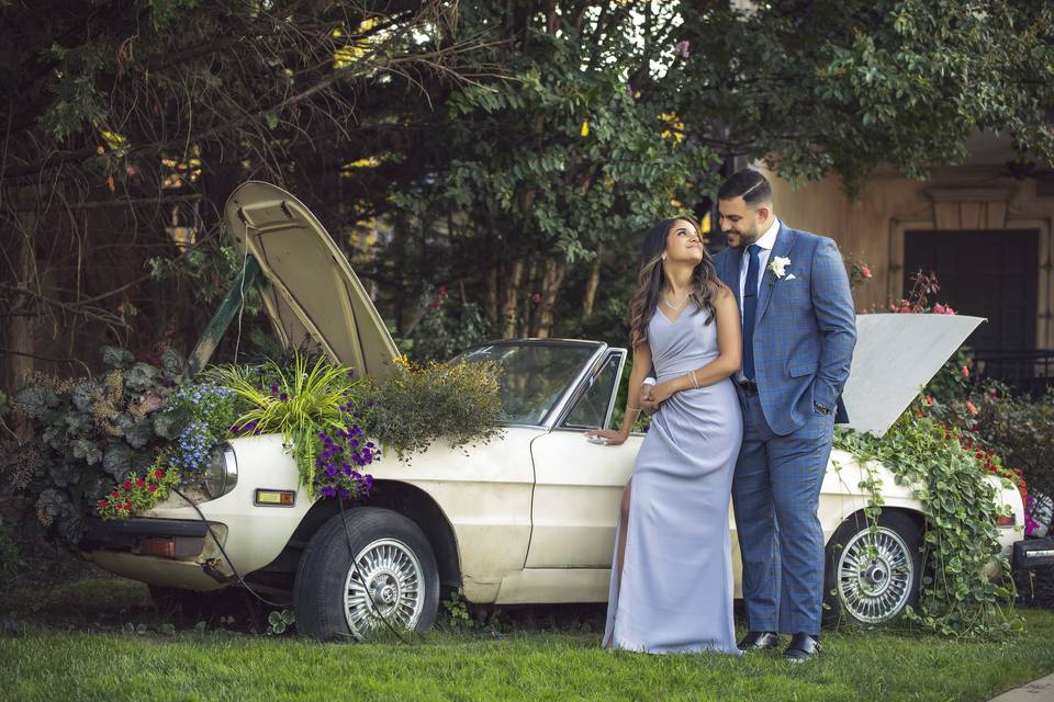 Newlyweds with wedding car