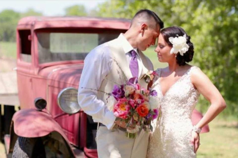 Newlyweds by the truck
