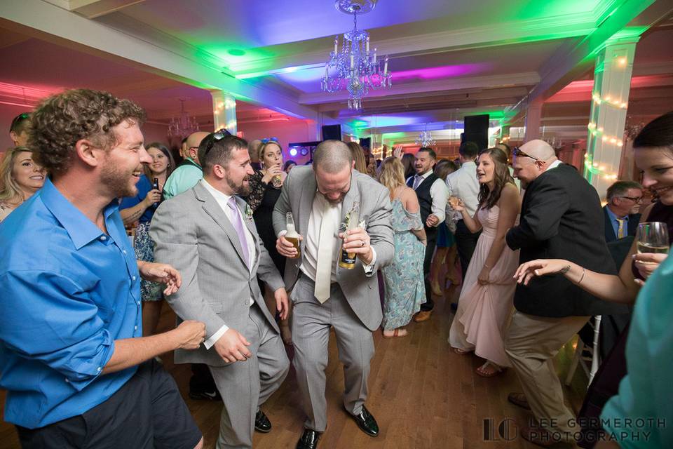 Groom and guests dancing