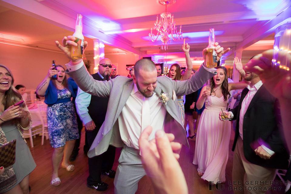 Groom and guests dancing