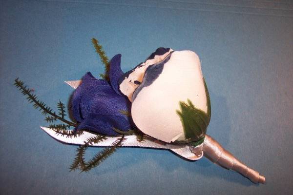 Blue and white double rose Boutonniere with blue tipping.
