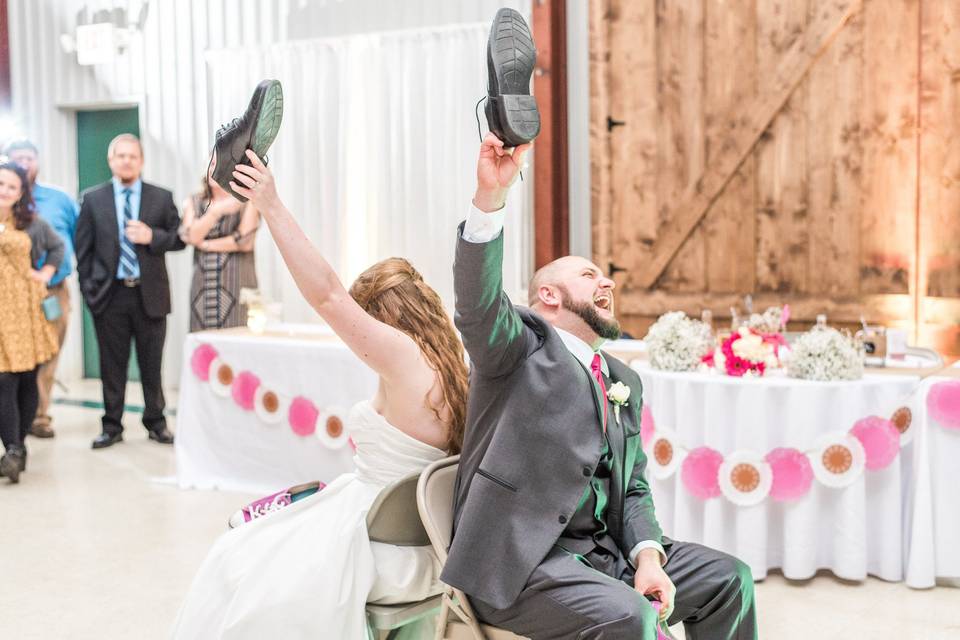 Bride and groom playing the shoe game