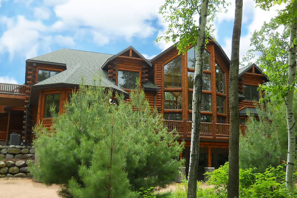 View of the back of the lodge from the path to the lake