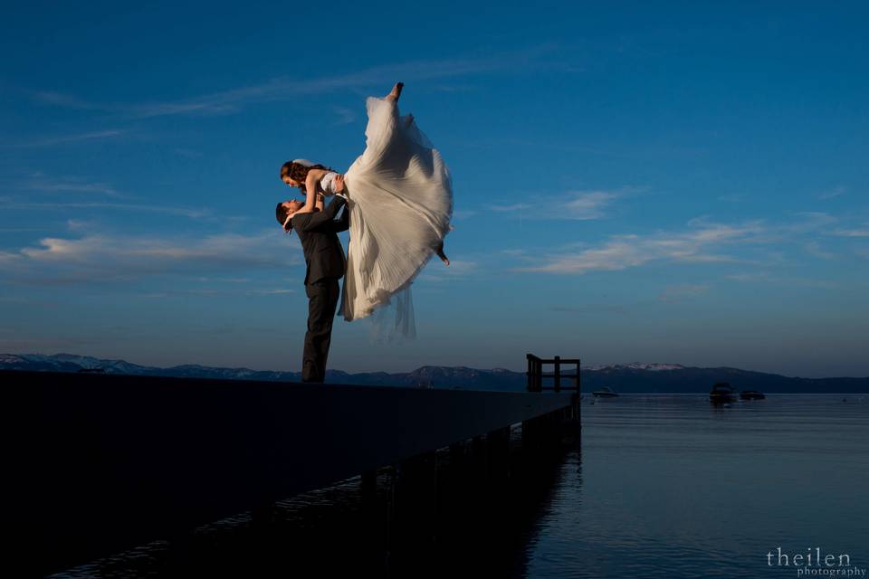 Groom lifts his bride