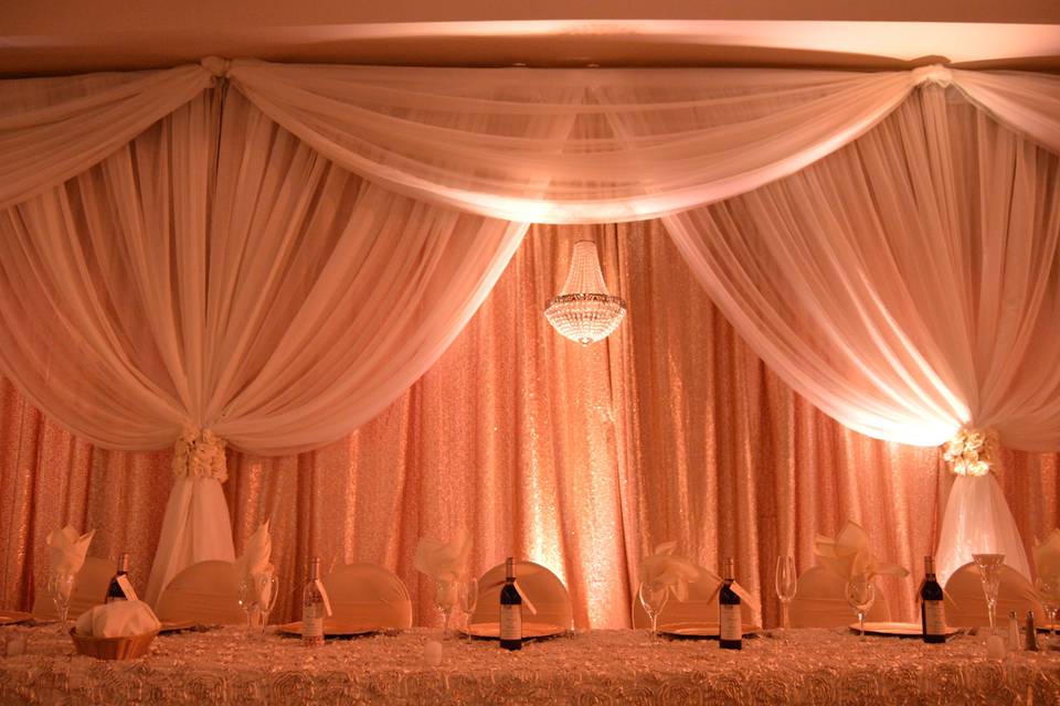 Head table lighting and drapery