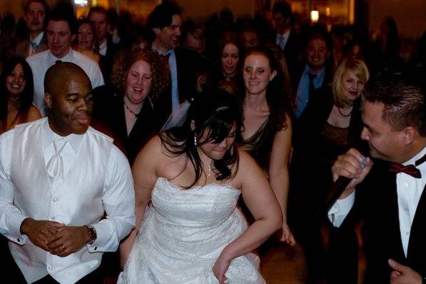 Couple and guests dancing