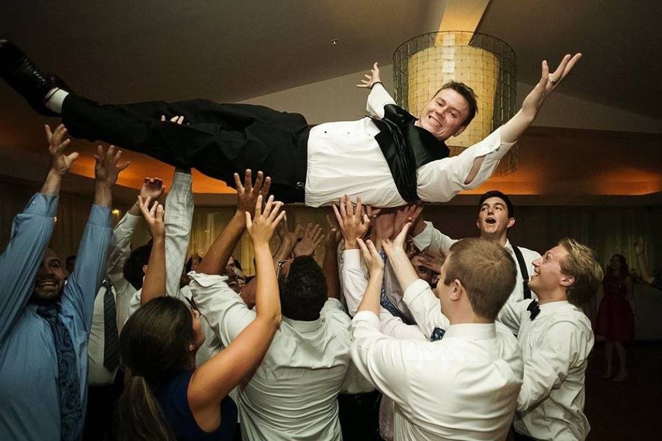 Groom crowd surfing