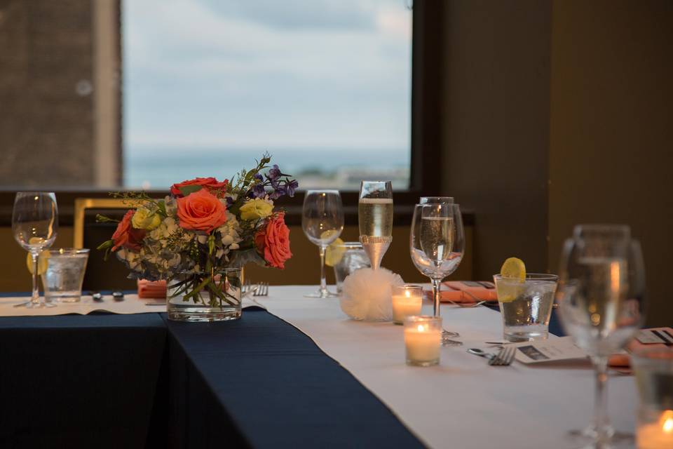 Table setup with bouquet and candle centerpiece