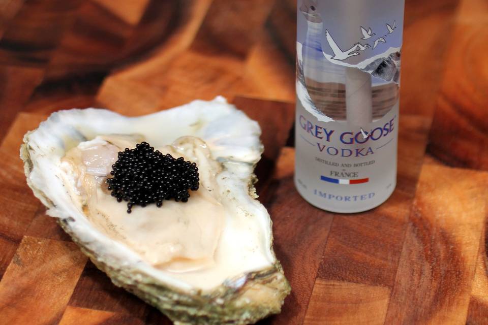 Oysters and Martinis in miniature Grey Goose bottle