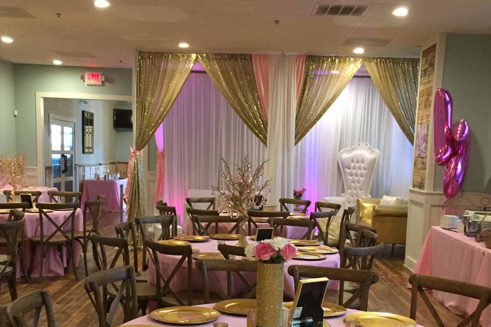 Tables covered in pink cloth