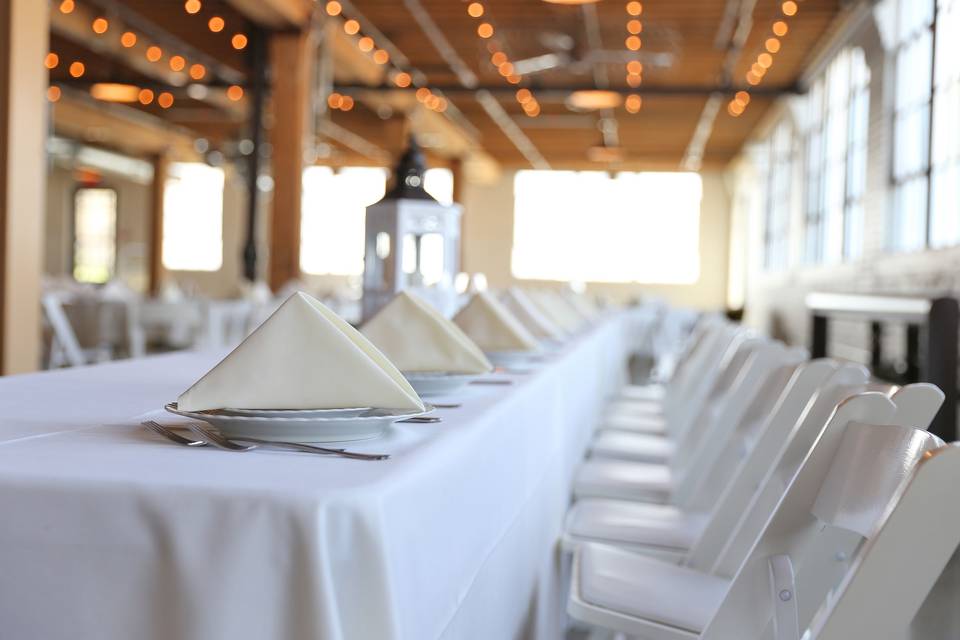 WHITE LINENS, IVORY NAPKINS, WHITE GARDEN CHAIRS