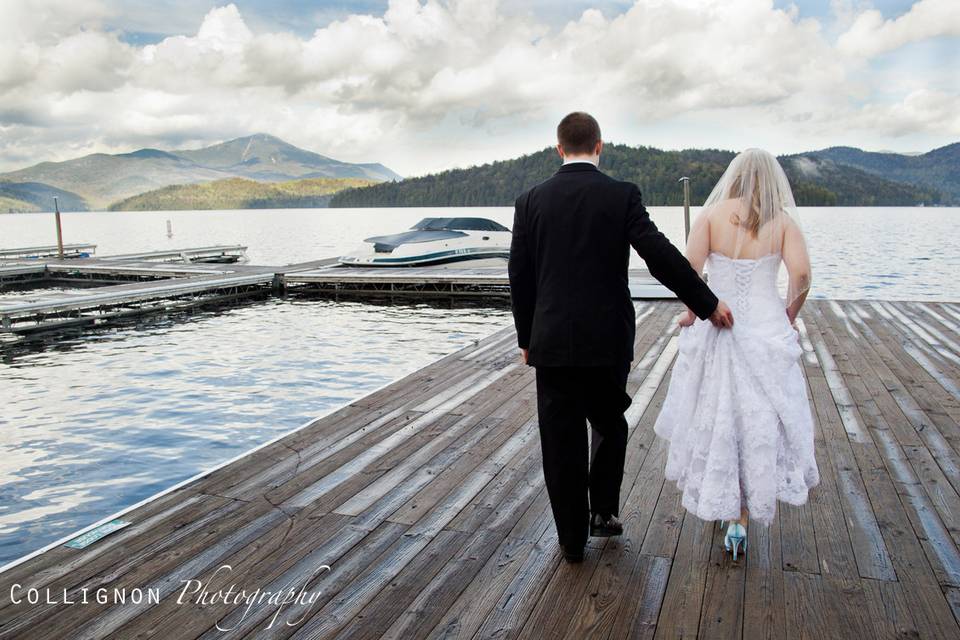 Bride and Groom strolling on Adirondack Dock