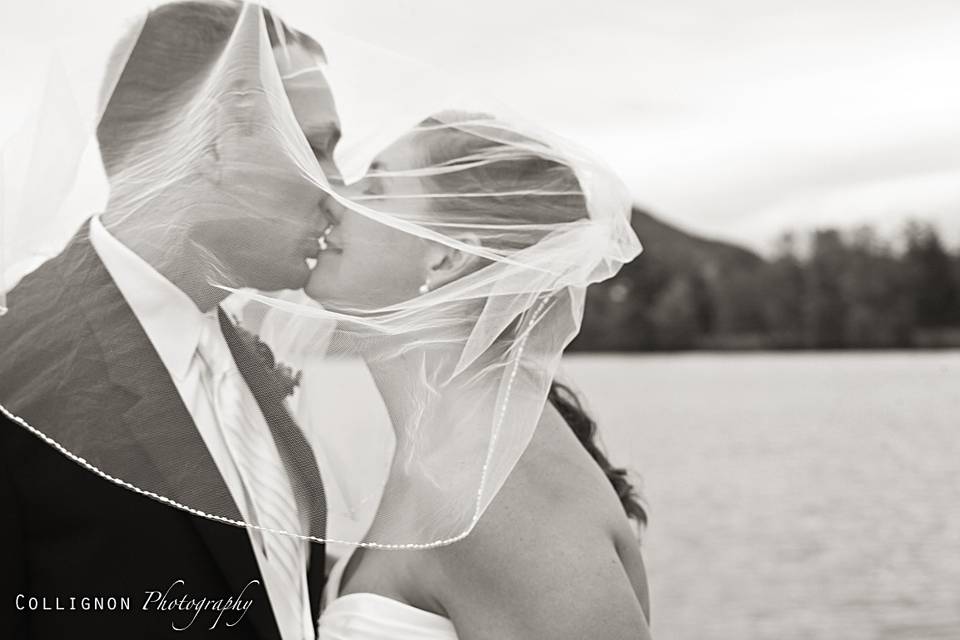 Kissing under a windblown veil
