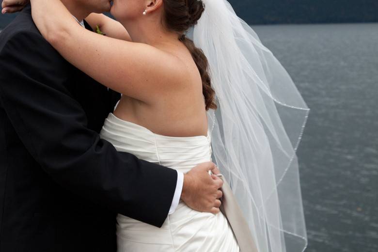Bride and Grooms Kiss on Lake George, NY