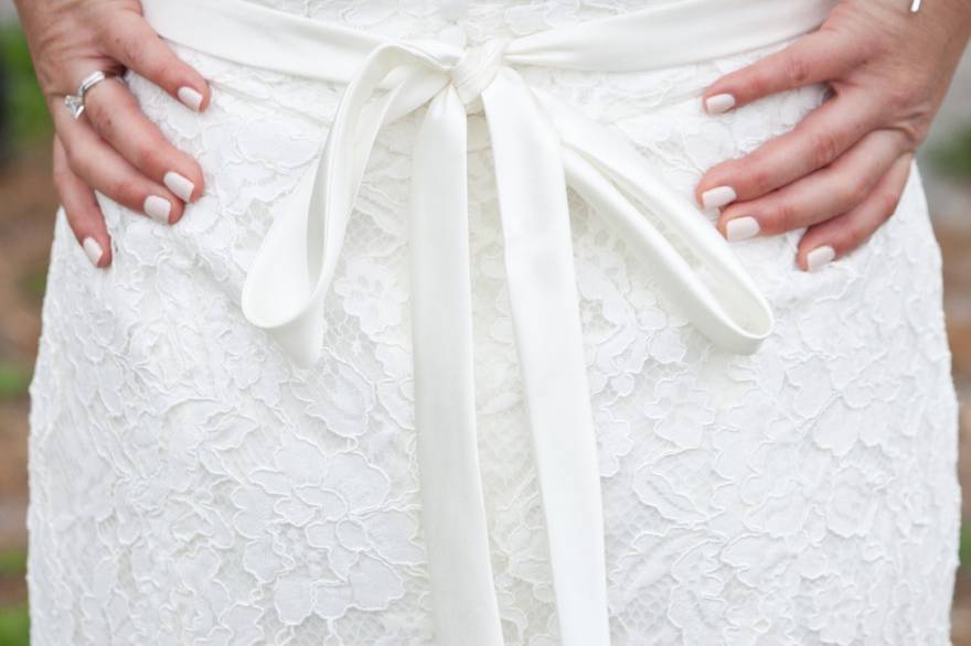 Beautifully feminine shot of the back of the brides dress