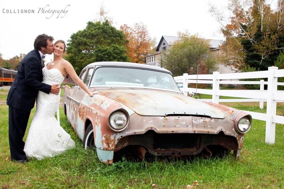 Rustic Modern Shot of the Bride and Groom by this old abandoned car
