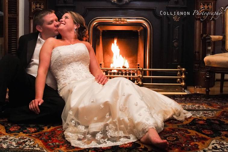 Bride and Groom by the fireplace