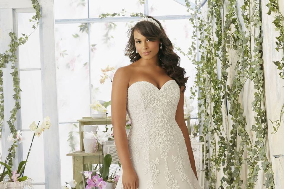 Gown with scalloped hemline