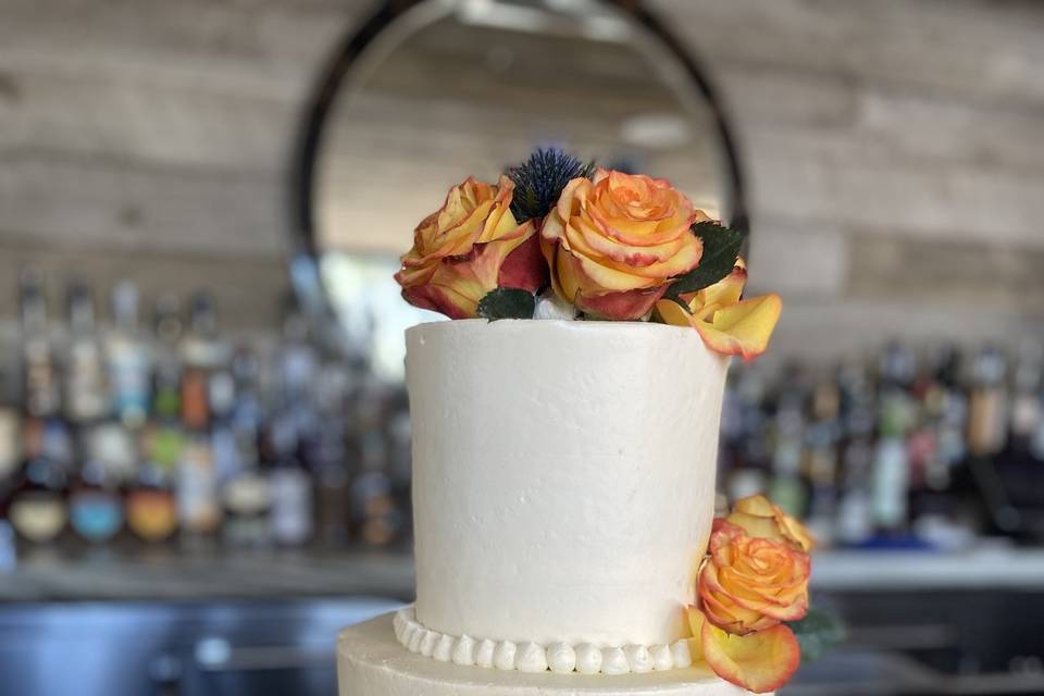 Orange flowers wedding cake