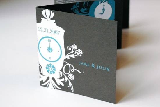 Julie and Jake met through a series of fortuitous events, which inspired us to base their wedding event identity on the concept of time. Their New Years Eve nuptials are announced through this accordion folded invitation. Illustrious clocks and event information are silk-screened onto deep chocolate cover stock. The ceremony program followed this aesthetic with an accordion construction. Additionally, Mélangerie designed a delicate clock with a customized face to serve as the wedding cake topper.