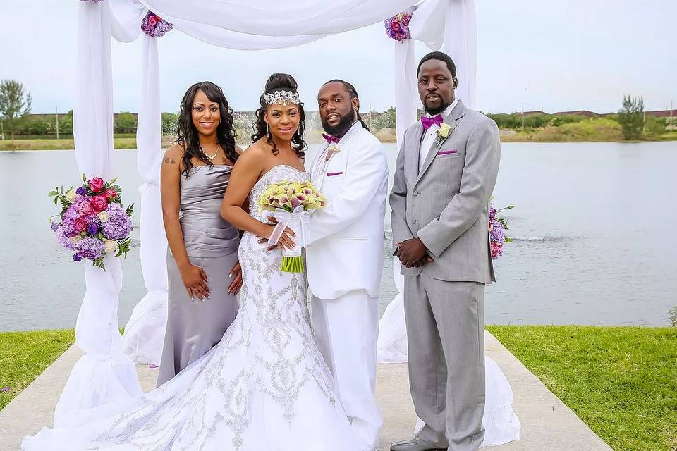 The couple with the bridesmaid and groomsman