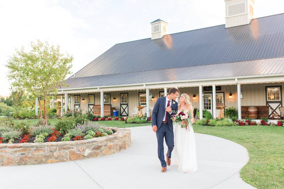 Newlyweds walking down the driveway