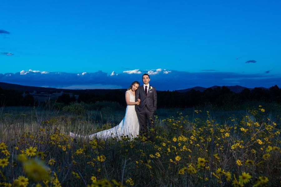 Couple standing in a field of flowers