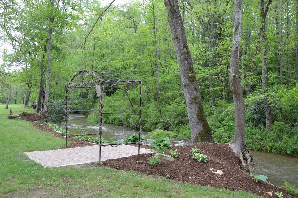 Metal arbor by the creek