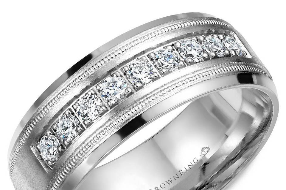 WB-9083This chic and detailed wedding band with nine round diamonds and milgrain detailing is created to make your love a statement.METAL: WhiteWIDTH: 8mmStone Type: DiamondStone Shape: RoundNumber of stones: 9Clarity: FG Sl1Total carat Weight: 0.45ctOther Availability: This ring is available in 10K, 14K, 18K (White, Yellow & Rose gold), Platinum & Palladium.