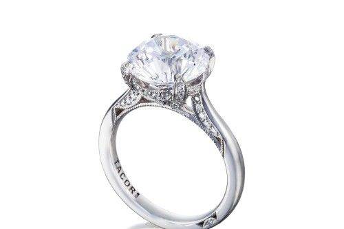 TACORIht2625rd10 All eyes will be on your center diamond, in this not so simple solitaire round cut diamond engagement ring. A sleek band with secret diamond details along the inner face of the band brings your brilliant round cut diamond to life, making it worthy of your love.